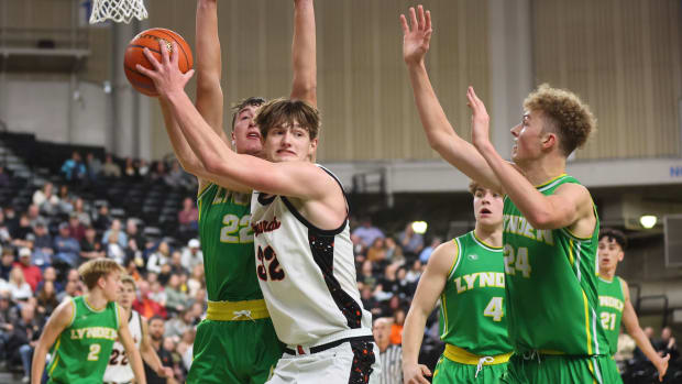 Zillah's Nic Navarre is defended by a pair of Lynden players during Thursday night's game at the SunDome Shootout in Yakima, Wash.